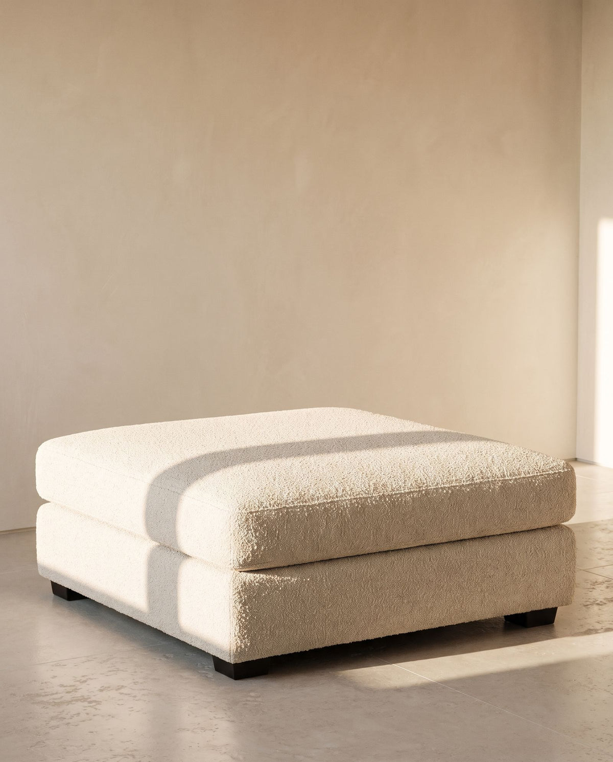 Sardinia Ottoman in ivory bouclé